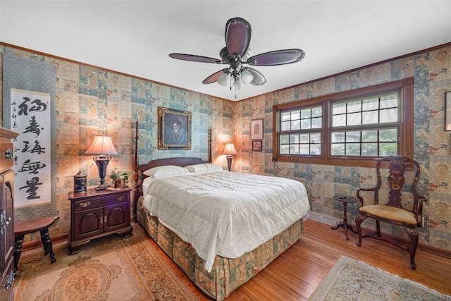 3009 Terry Dr SE, Cedar Rapids, IA 52403 - bedroom featuring light wood-style flooring, wallpapered walls, baseboards, a ceiling fan, and ornamental molding