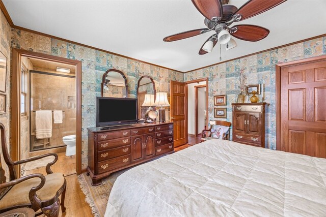 3009 Terry Dr SE, Cedar Rapids, IA 52403 - bedroom with light wood finished floors, ornamental molding, wallpapered walls, connected bathroom, and a ceiling fan