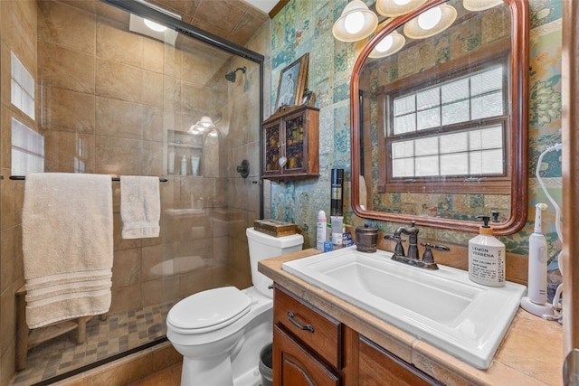 3009 Terry Dr SE, Cedar Rapids, IA 52403 - full bath with wallpapered walls, tiled shower, vanity, and toilet