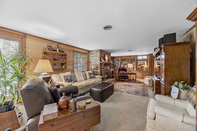 3009 Terry Dr SE, Cedar Rapids, IA 52403 - living room featuring wood walls and carpet