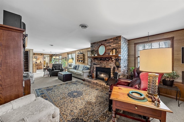 3009 Terry Dr SE, Cedar Rapids, IA 52403 - carpeted living room with a fireplace, healthy amount of natural light, and wood walls