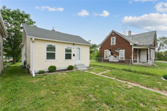 944 L St SW, Cedar Rapids, IA 52404 - rear view of property featuring entry steps and a chimney