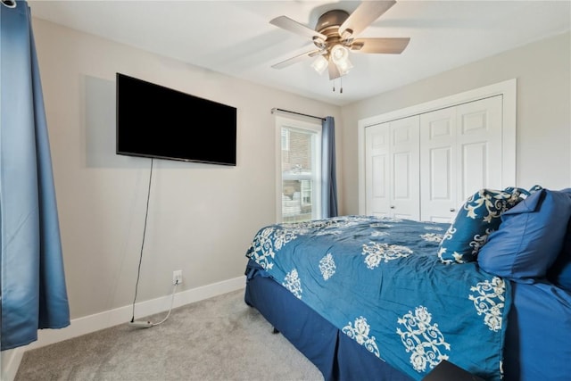 944 L St SW, Cedar Rapids, IA 52404 - carpeted bedroom featuring a closet, baseboards, and ceiling fan