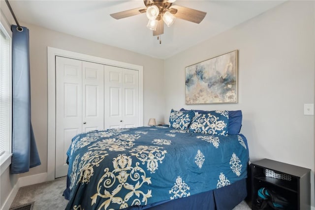 944 L St SW, Cedar Rapids, IA 52404 - carpeted bedroom with a closet, baseboards, and ceiling fan