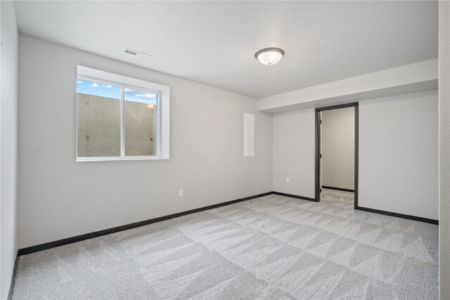 5017 Bluestem St SW, Kalona, IA 52247 - unfurnished bedroom featuring light carpet, baseboards, and a closet