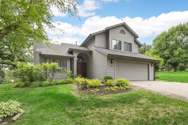 13 S View Dr NE, Iowa City, IA 52240 - tri-level home with a garage, driveway, a front yard, a chimney, and roof with shingles