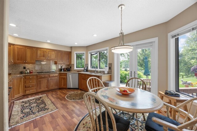 13 S View Dr NE, Iowa City, IA 52240 - dining room featuring dark wood-style floors, plenty of natural light, a textured ceiling, recessed lighting, and french doors
