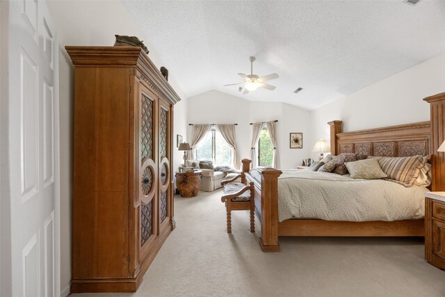 13 S View Dr NE, Iowa City, IA 52240 - bedroom with light carpet, lofted ceiling, ceiling fan, and a textured ceiling