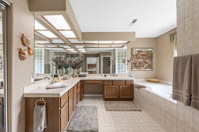 13 S View Dr NE, Iowa City, IA 52240 - full bathroom with a bath, double vanity, and tile patterned floors