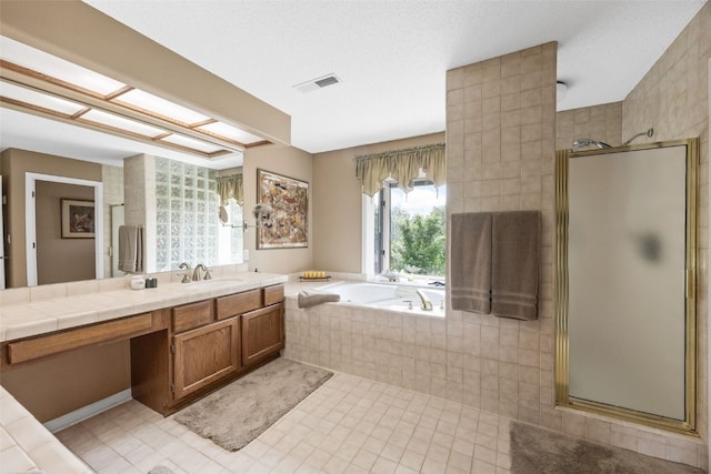13 S View Dr NE, Iowa City, IA 52240 - full bathroom featuring a stall shower, a garden tub, vanity, and tile patterned flooring