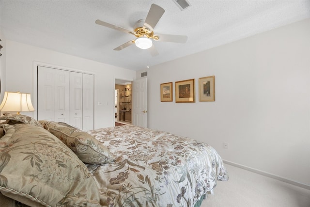 13 S View Dr NE, Iowa City, IA 52240 - bedroom with carpet, a closet, and a ceiling fan