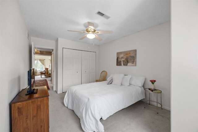 13 S View Dr NE, Iowa City, IA 52240 - bedroom featuring light colored carpet, a closet, a ceiling fan, and baseboards