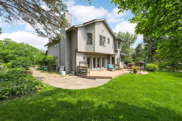 13 S View Dr NE, Iowa City, IA 52240 - rear view of house featuring a chimney, french doors, a deck, and a yard