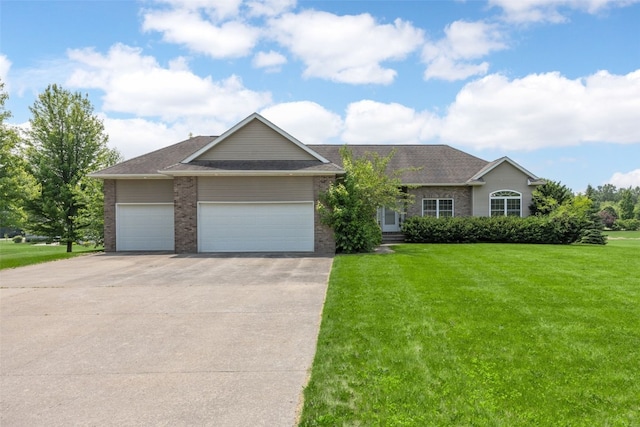 3017 Peaceful Dr, Riverside, IA 52327 - ranch-style home featuring an attached garage, concrete driveway, a front lawn, brick siding, and a shingled roof