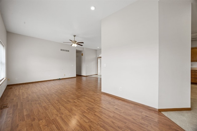 3017 Peaceful Dr, Riverside, IA 52327 - empty room with a ceiling fan, light wood-style flooring, baseboards, and recessed lighting