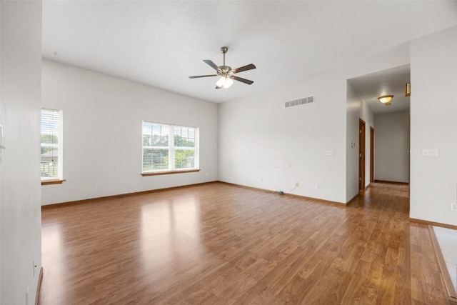 3017 Peaceful Dr, Riverside, IA 52327 - unfurnished room with ceiling fan, light wood finished floors, and baseboards