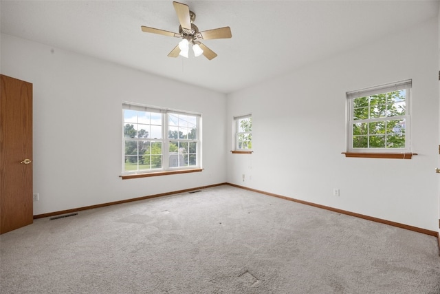 3017 Peaceful Dr, Riverside, IA 52327 - carpeted spare room featuring baseboards and a ceiling fan