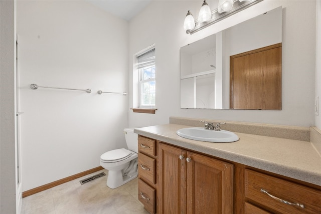 3017 Peaceful Dr, Riverside, IA 52327 - bathroom with vanity, toilet, and tile patterned floors