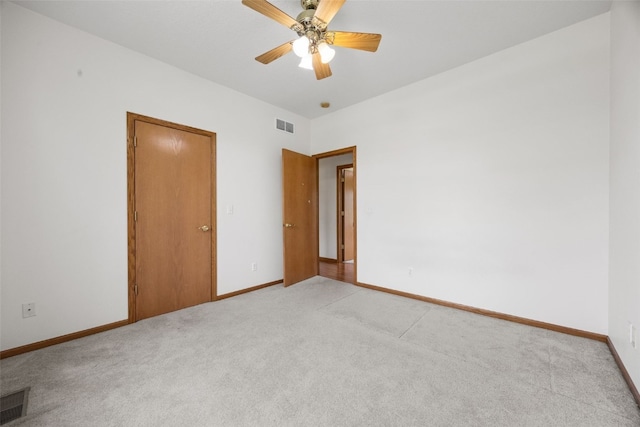 3017 Peaceful Dr, Riverside, IA 52327 - empty room featuring light carpet, baseboards, and a ceiling fan