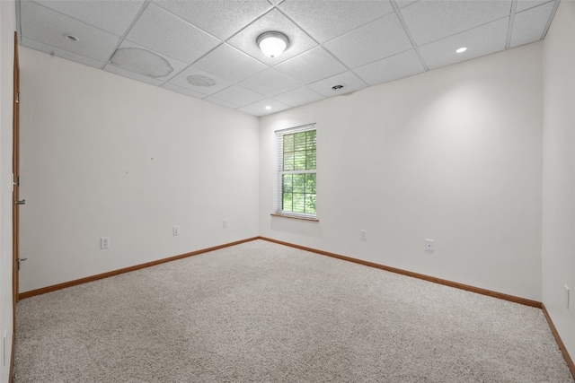 3017 Peaceful Dr, Riverside, IA 52327 - spare room featuring a drop ceiling, carpet flooring, baseboards, and recessed lighting