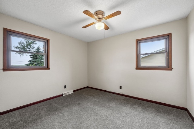 17 C Ave, Newhall, IA 52315 - carpeted spare room with ceiling fan and baseboards