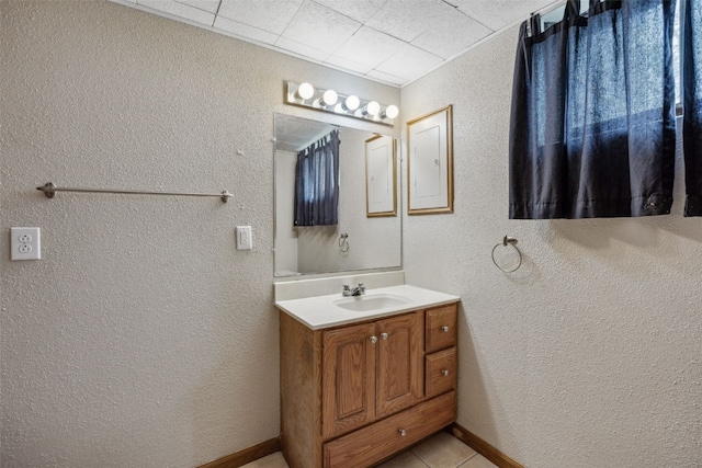 17 C Ave, Newhall, IA 52315 - bathroom with vanity, a textured wall, and tile patterned floors