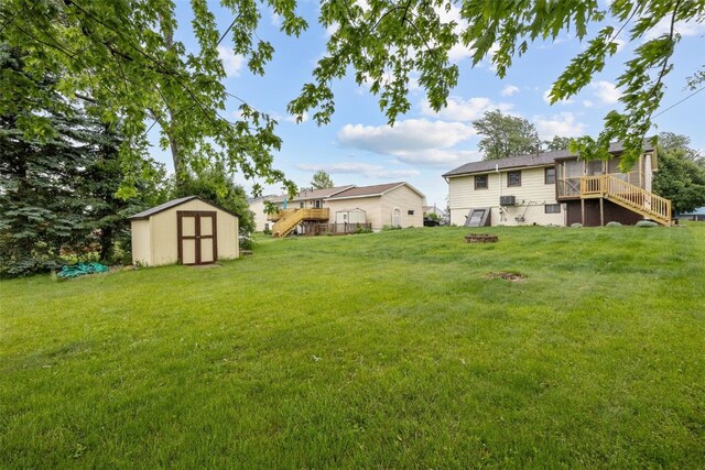 17 C Ave, Newhall, IA 52315 - view of green lawn with stairway, a deck, and a sunroom