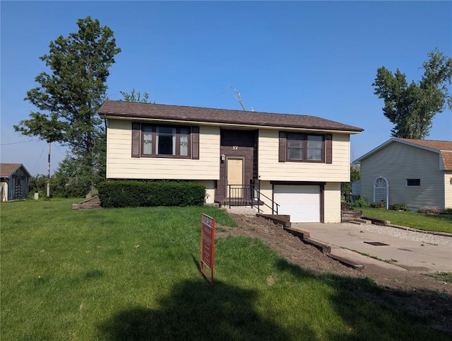 17 C Ave, Newhall, IA 52315 - bi-level home with driveway, an attached garage, and a front yard