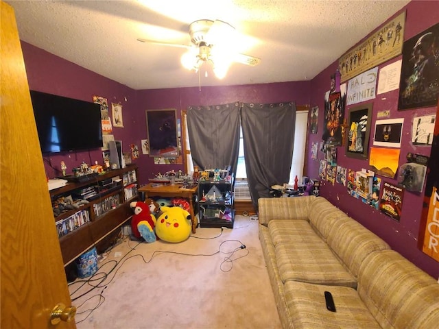1114 2nd Ave, Vinton, IA 52349 - carpeted living area featuring a ceiling fan and a textured ceiling