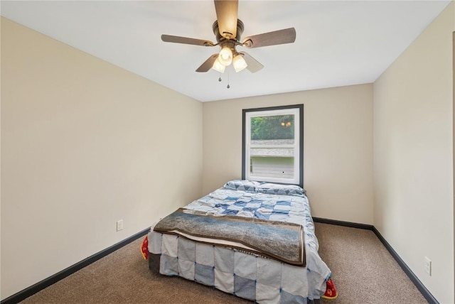 1805 4th Ave, South Amana, IA 52334 - carpeted bedroom with baseboards and a ceiling fan