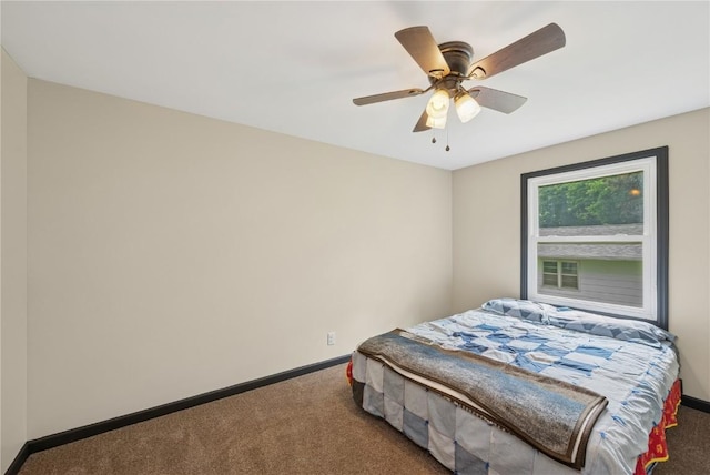 1805 4th Ave, South Amana, IA 52334 - carpeted bedroom with baseboards and ceiling fan