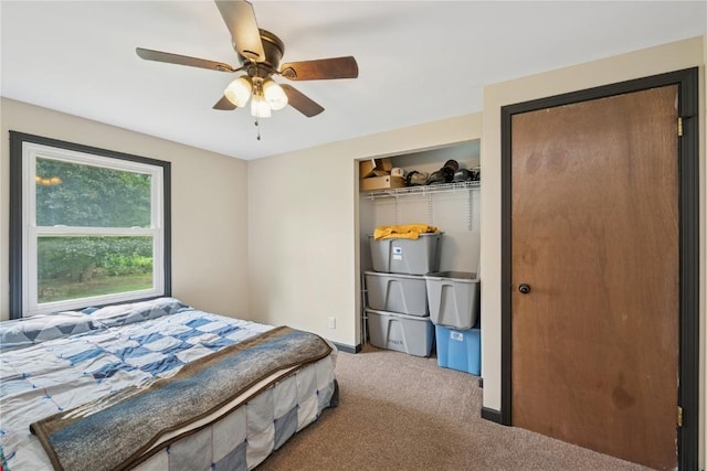 1805 4th Ave, South Amana, IA 52334 - carpeted bedroom featuring ceiling fan and baseboards