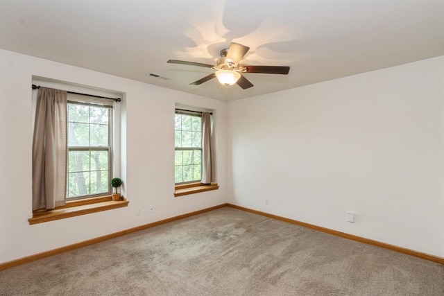 1080 Rachael St Unit 304, North Liberty, IA 52317 - empty room featuring baseboards, carpet, and a ceiling fan