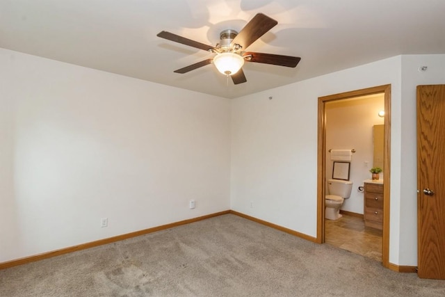 1080 Rachael St Unit 304, North Liberty, IA 52317 - unfurnished room with light carpet, a ceiling fan, and baseboards