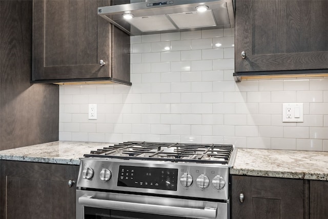 6318 Rapids Ridge Rd NE, Cedar Rapids, IA 52411 - kitchen with gas stove, ventilation hood, and dark brown cabinetry