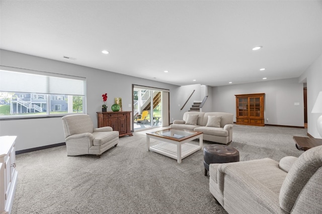 6318 Rapids Ridge Rd NE, Cedar Rapids, IA 52411 - living area with light colored carpet, recessed lighting, stairway, and baseboards