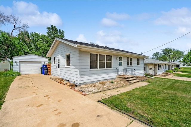 32 29th Ave SW, Cedar Rapids, IA 52404 - view of front of home featuring an outbuilding, a detached garage, a front lawn, and driveway
