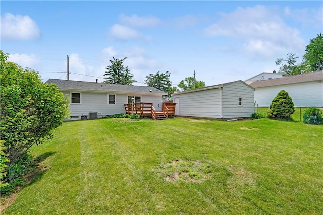 32 29th Ave SW, Cedar Rapids, IA 52404 - back of house with a deck, a yard, and central AC unit