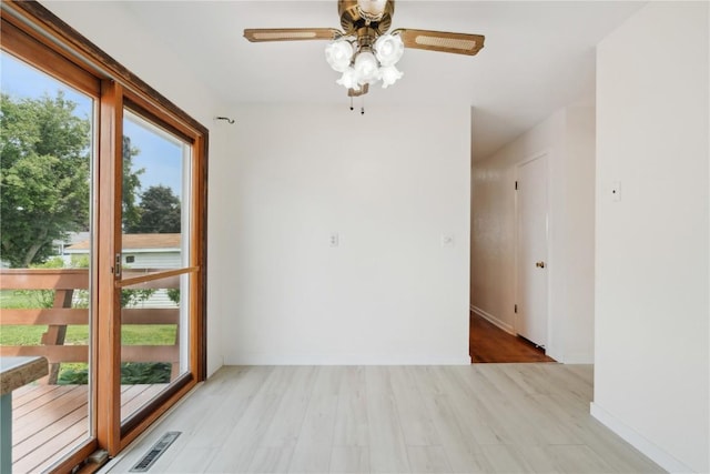 32 29th Ave SW, Cedar Rapids, IA 52404 - unfurnished room featuring a ceiling fan, wood finished floors, and baseboards