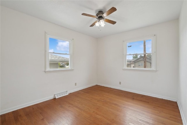 32 29th Ave SW, Cedar Rapids, IA 52404 - unfurnished room featuring light wood-style floors, baseboards, and a ceiling fan