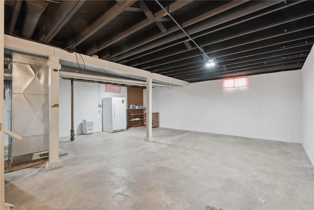 1252 29th St, Cedar Rapids, IA 52402 - below grade area featuring freestanding refrigerator