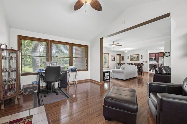 4427 J St SW, Cedar Rapids, IA 52404 - office featuring ceiling fan, vaulted ceiling, wood finished floors, and baseboards