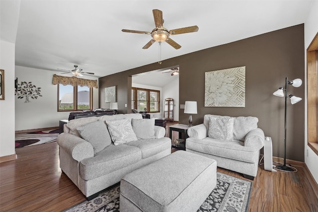 4427 J St SW, Cedar Rapids, IA 52404 - living room featuring a ceiling fan, baseboards, and wood finished floors