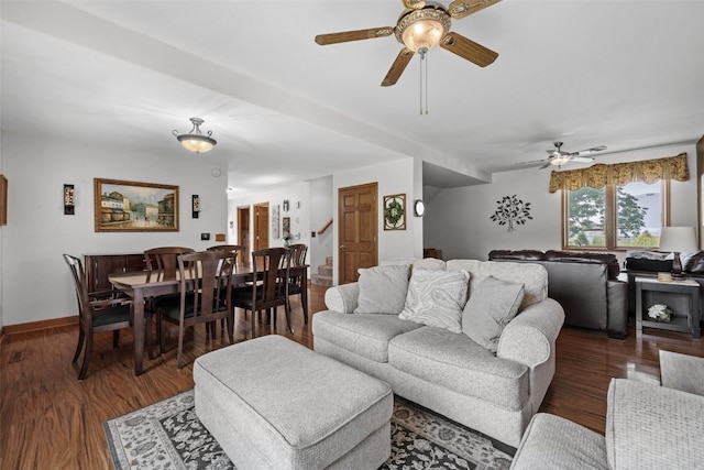 4427 J St SW, Cedar Rapids, IA 52404 - living area featuring a ceiling fan, wood finished floors, stairs, and baseboards