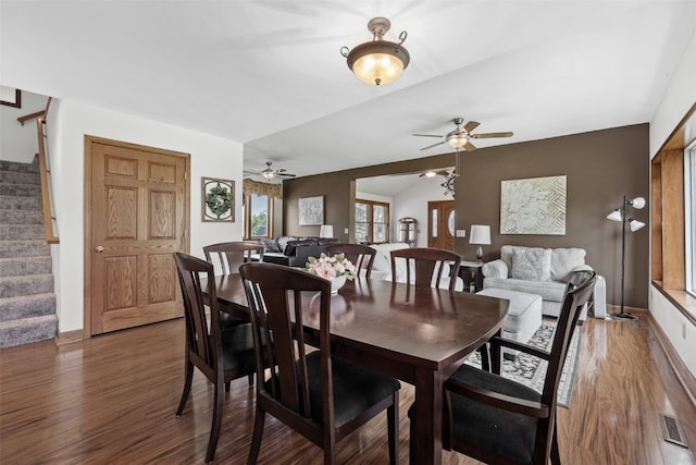 4427 J St SW, Cedar Rapids, IA 52404 - dining space with stairs, a ceiling fan, wood finished floors, and baseboards