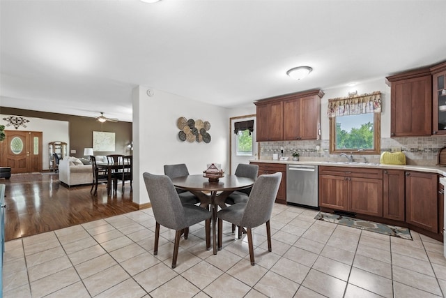 4427 J St SW, Cedar Rapids, IA 52404 - dining area featuring light tile patterned floors and a ceiling fan