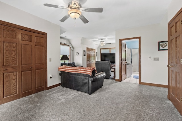 4427 J St SW, Cedar Rapids, IA 52404 - living area with ceiling fan, light carpet, baseboards, vaulted ceiling, and a wall mounted air conditioner