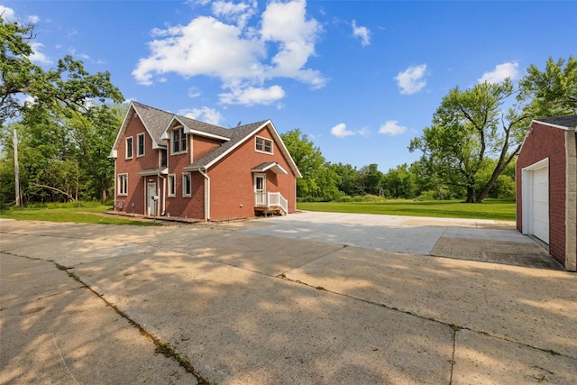 4427 J St SW, Cedar Rapids, IA 52404 - view of side of property featuring brick siding and a lawn