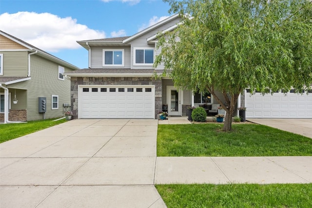 1221 Ronald Way, North Liberty, IA 52317 - craftsman house with stone siding, a front lawn, concrete driveway, and a garage