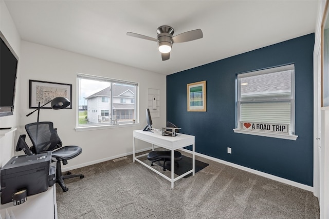 1221 Ronald Way, North Liberty, IA 52317 - home office featuring ceiling fan, carpet flooring, and baseboards